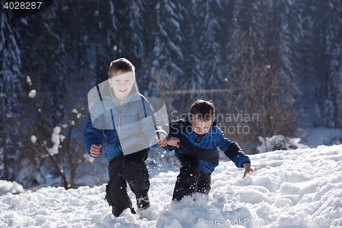 Image of kids playing with  fresh snow