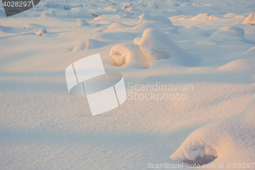 Image of landscape. weather, snowdrifts in the foreground