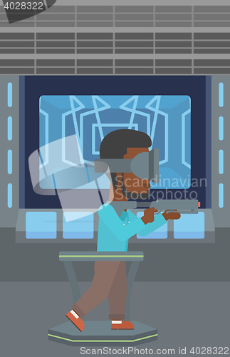 Image of Man in virtual reality headset playing video game.