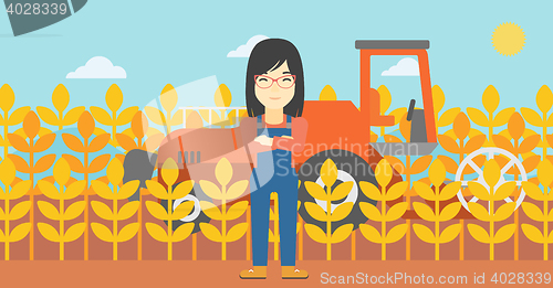 Image of Woman standing with combine on background.