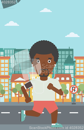 Image of Man running with earphones and smartphone.