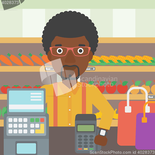 Image of Man paying wireless with smart watch.