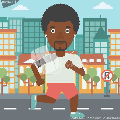 Image of Man running with earphones and smartphone.