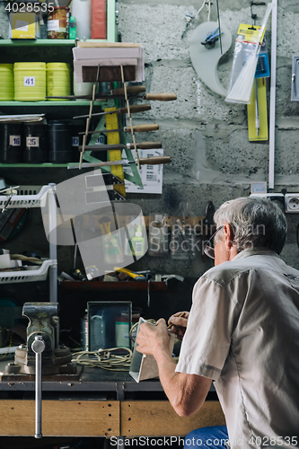 Image of Senior mechanic working in garage