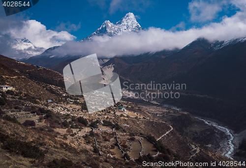 Image of Ama Dablam and Nepalese village in Himalayas