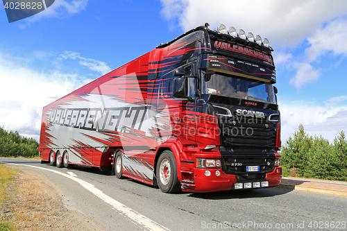 Image of Red Scania R 730 Semi of Valcarenghi on the Road