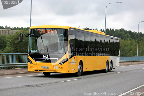 Image of Yellow Volvo 8900 Bus in Urban Environment