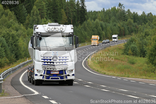 Image of White Mercedes-Benz Arocs 3258L Truck on the Road