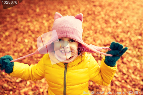 Image of happy little girl in autumn park