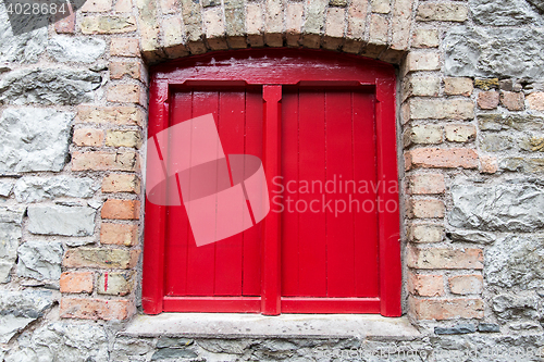 Image of close up of vintage window in old stone wall