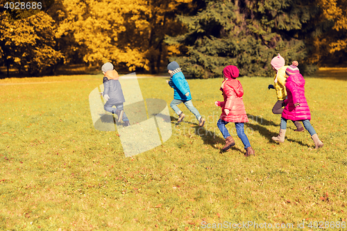 Image of group of happy little kids running outdoors