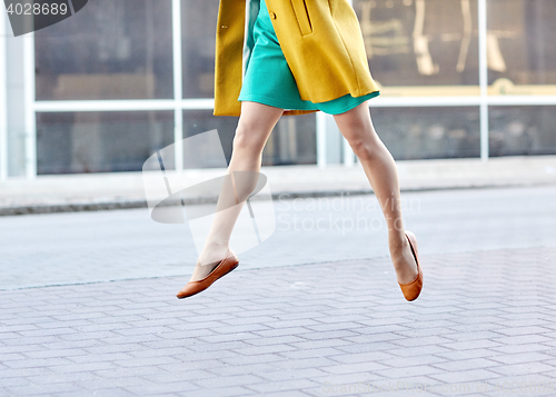 Image of young woman or teenage girl legs on city street