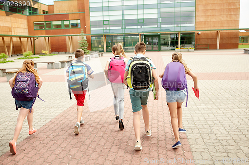 Image of group of happy elementary school students running