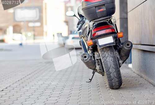 Image of close up of motorcycle parked on city street