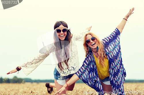 Image of happy hippie women having fun on cereal field