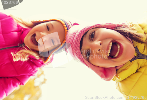 Image of happy laughing girls faces outdoors