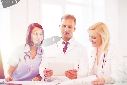 Image of doctors looking at tablet pc