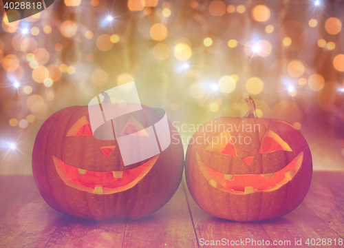 Image of close up of carved halloween pumpkins on table