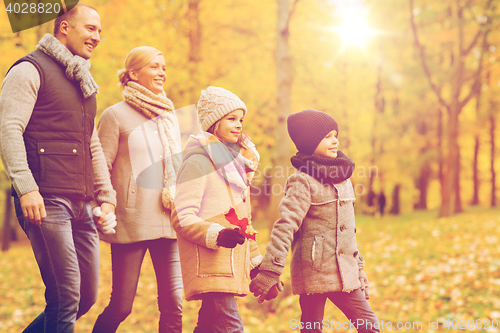 Image of happy family in autumn park
