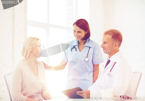 Image of doctor with patient in hospital