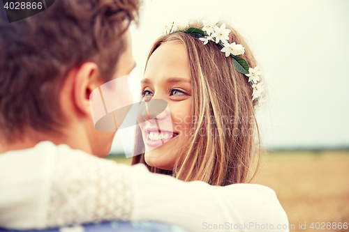 Image of happy smiling young hippie couple outdoors