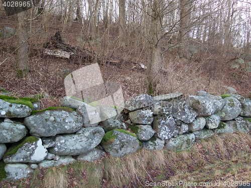 Image of one wall of stone called stone fence