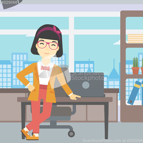 Image of Business woman standing in the office.