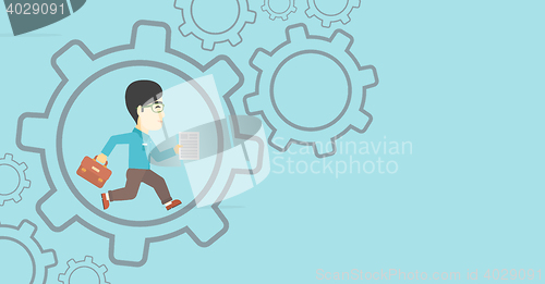 Image of Businessman running inside the gear.
