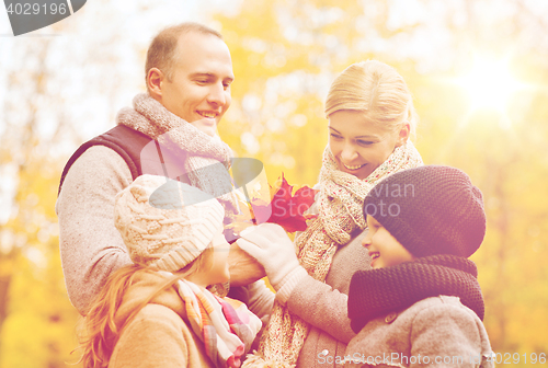 Image of happy family in autumn park