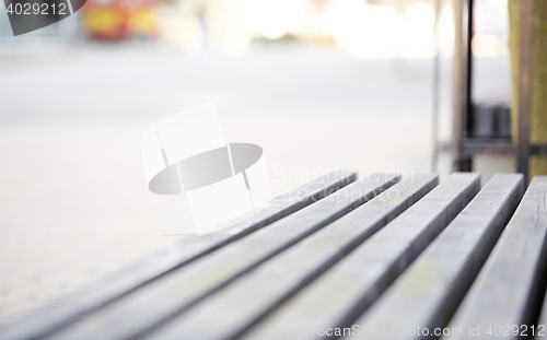 Image of close up of wooden city street bench