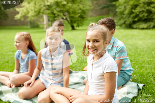 Image of group of happy kids or friends outdoors