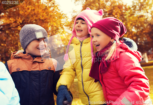 Image of group of happy children in autumn park