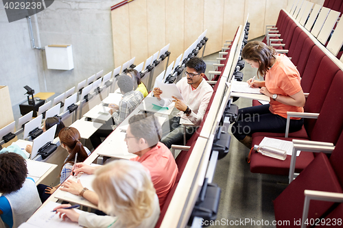 Image of group of students writing test at lecture hall