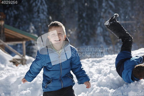 Image of kids playing with  fresh snow