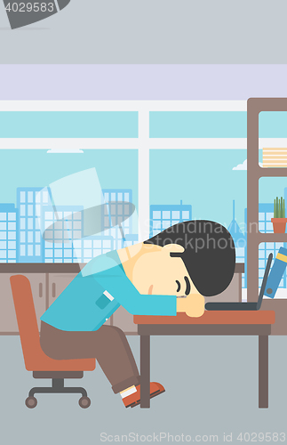 Image of Businessman sleeping on workplace.