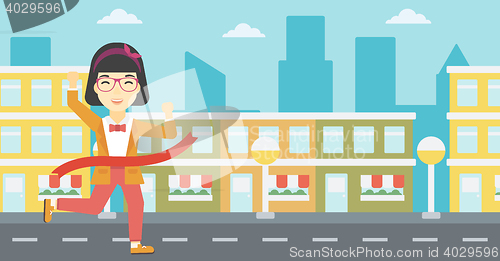 Image of Business woman crossing finish line.