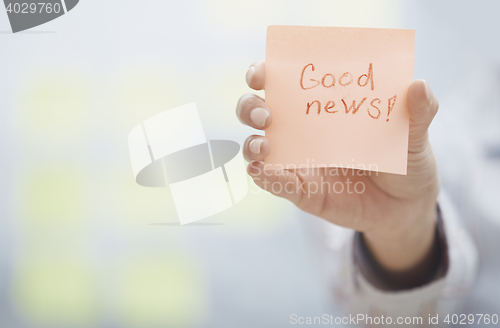 Image of Good news text on adhesive note