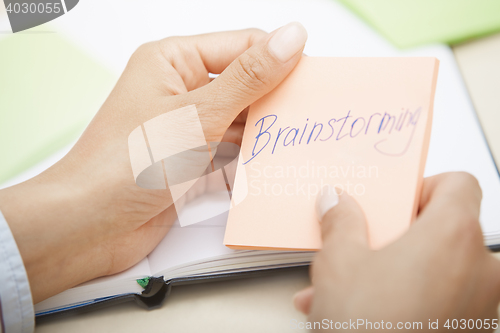 Image of Brainstorming text on adhesive note