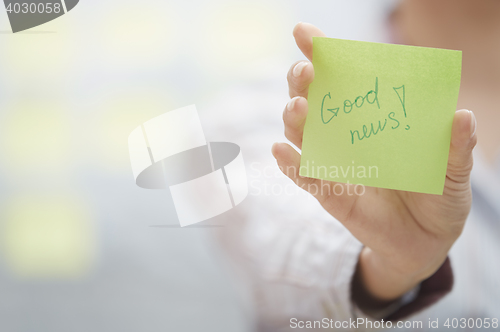 Image of Good news text on adhesive note