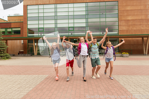 Image of group of happy elementary school students running