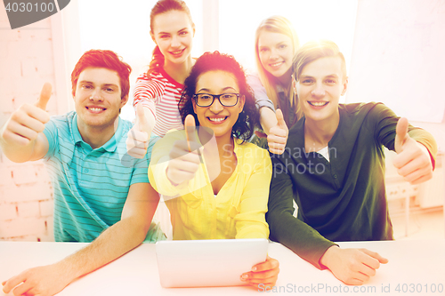 Image of smiling students with tablet pc computer at school