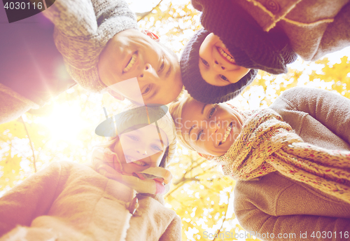 Image of happy family in autumn park