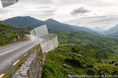 Image of asphalt road and hills at connemara in ireland