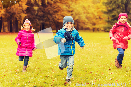 Image of group of happy little kids running outdoors