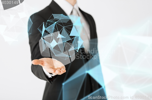 Image of close up of businessman showing virtual projection