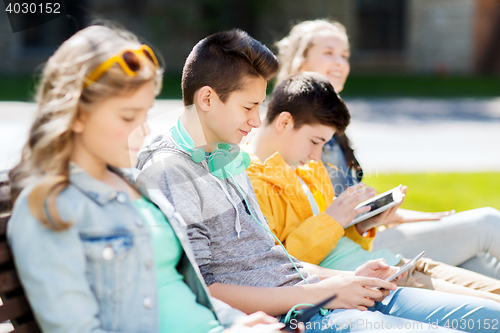 Image of happy teenage boy with tablet pc and headphones