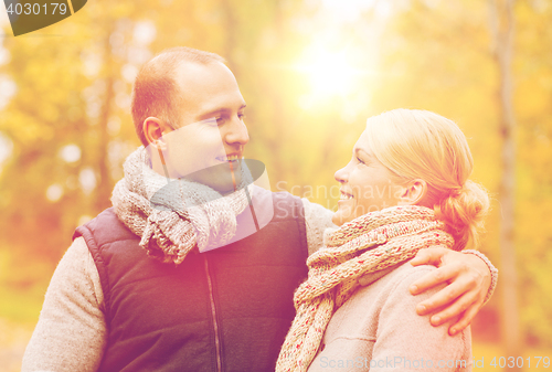 Image of smiling couple in autumn park