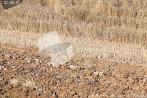 Image of plowed field, furrows