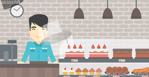 Image of Worker standing behind the counter at the bakery.