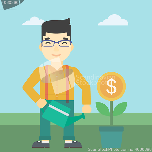 Image of Businessman watering money flower.